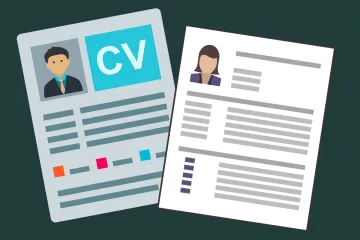 Two resumés on a table.