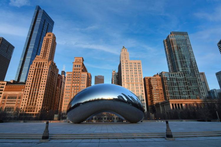 Cloud Gate sculpture, known as The Bean, in Millennium Park reflecting the Chicago skyline.