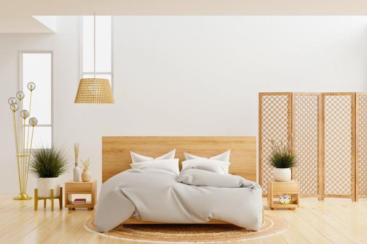 Asian minimalist bedroom with a low wooden bed and neutral decor.