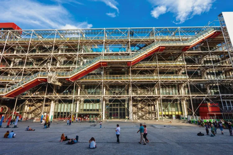 Exterior of the Pompidou Center in Paris, with its exposed industrial design and colorful external escalators.