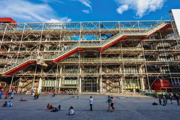 Exterior of the Pompidou Center in Paris, with its exposed industrial design and colorful external escalators.