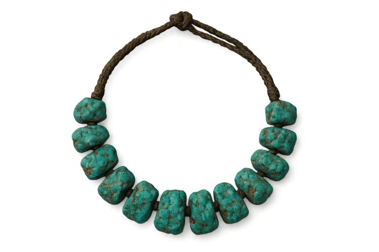 A turquoise beaded necklace isolated on white background.