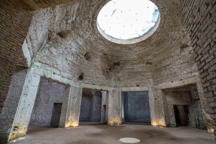 Ancient brick-vaulted chamber in the Domus Aurea, illuminated by daylight entering through an opening in the ceiling.